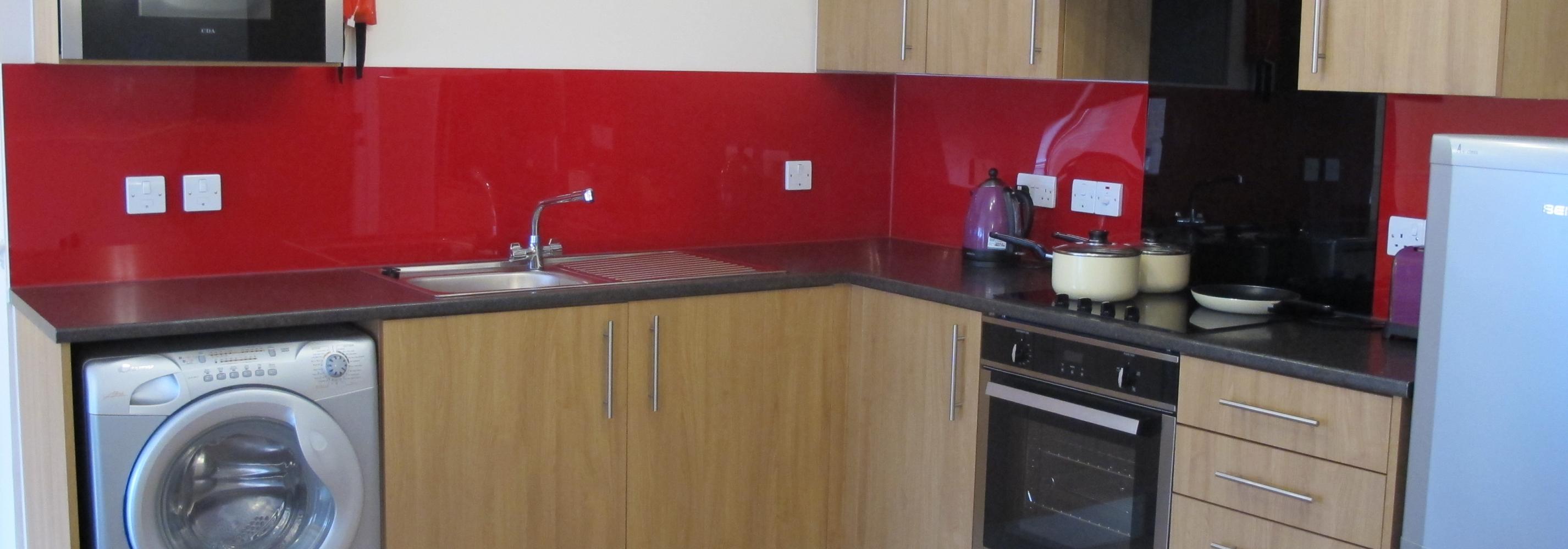 Kitchen, silver washing machine, oven, hob, extractor fan, 11 kitchen cupboards and draws, silver fridge, kettle and sink