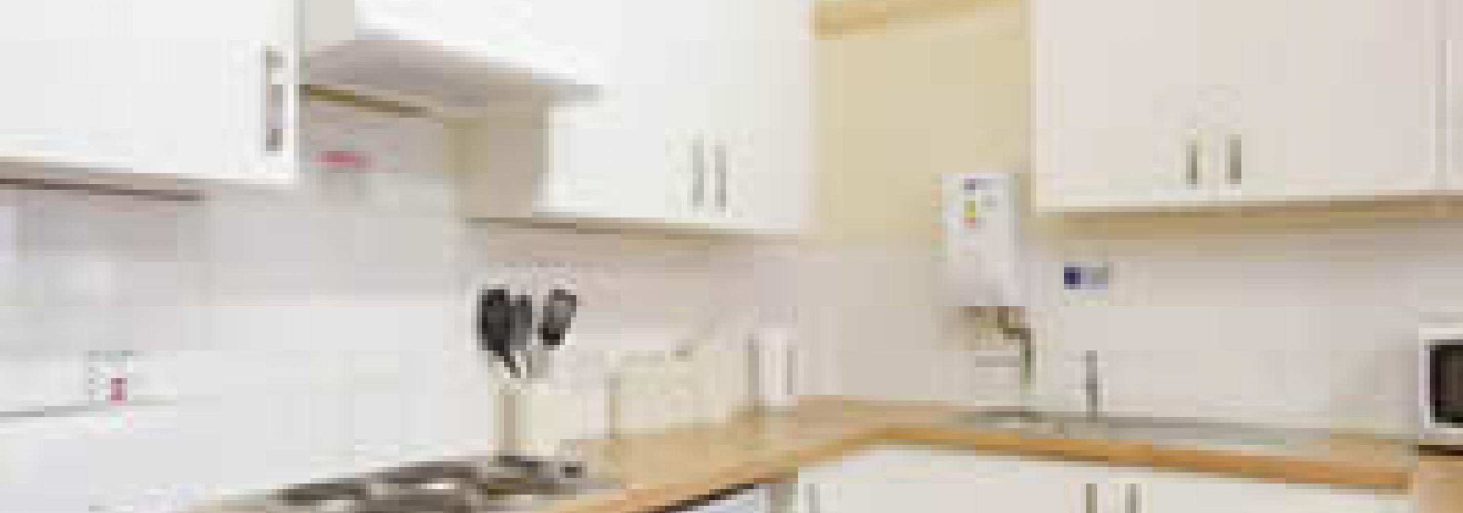 Kitchen with oven, hob, sink, microwave, kettle and toaster