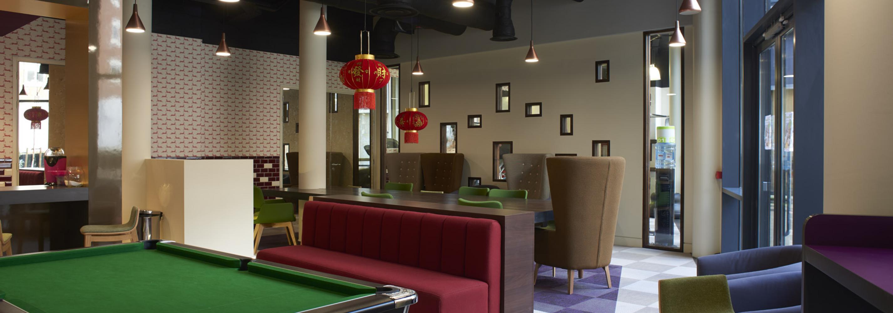 Communal area with seating and pool table