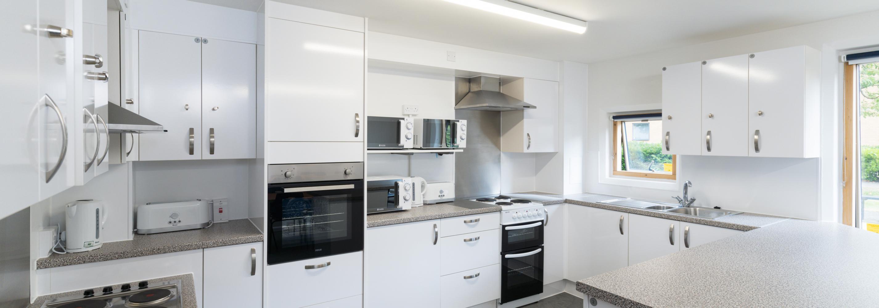 de Havilland shared kitchen, with two ovens, two microwaves and lockable shelves