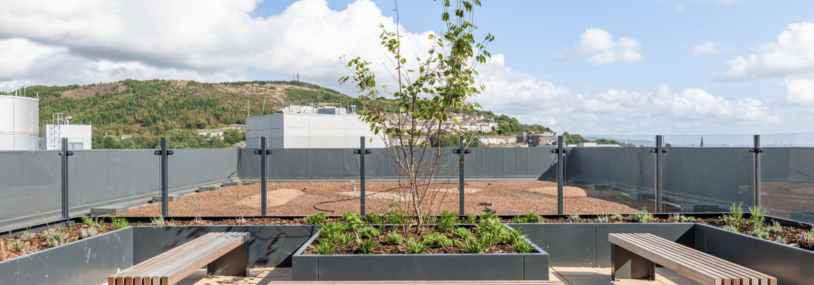 Rooftop terrace with seating and view